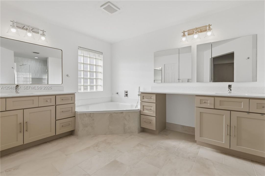 Main Bathroom with separate sinks.