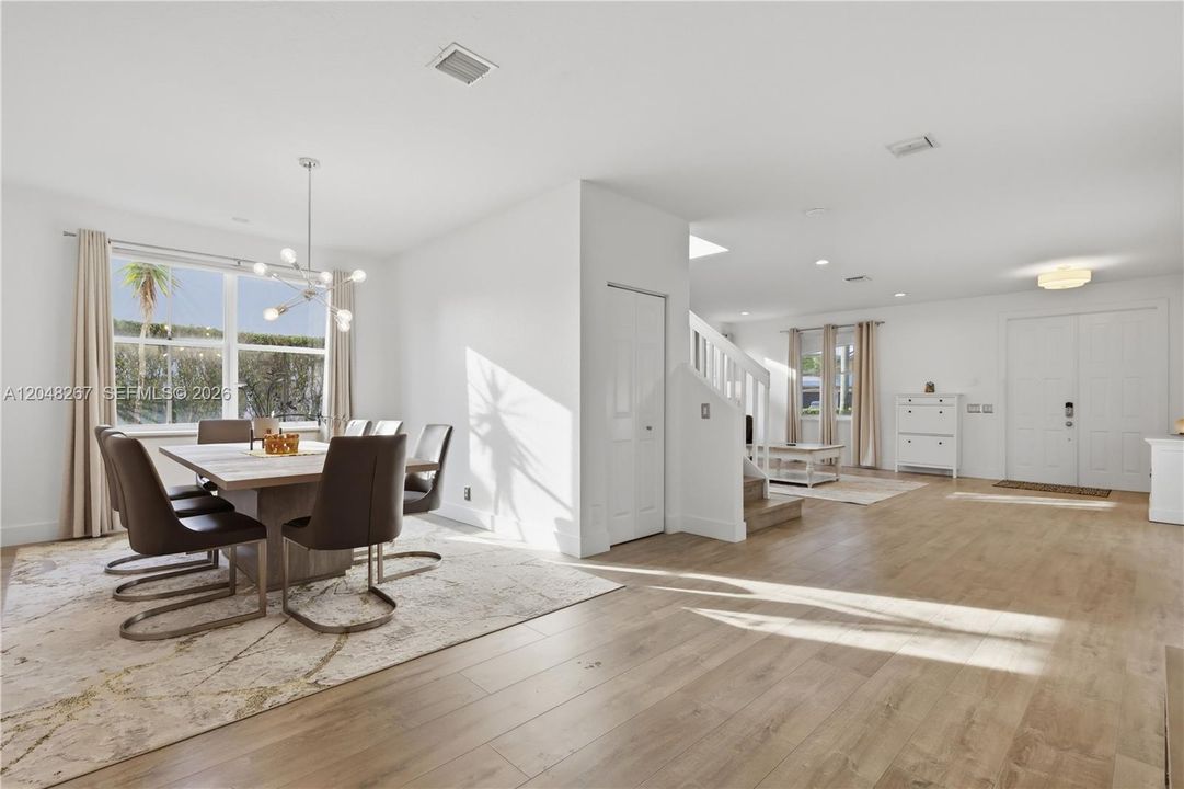 Dining Area and Living Room Area with under the stairs closet