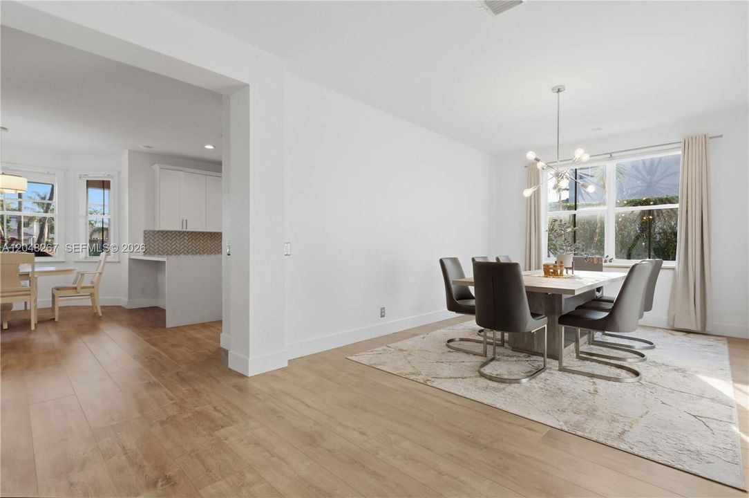 Formal Dining Area with a glimpse of the kitchen.