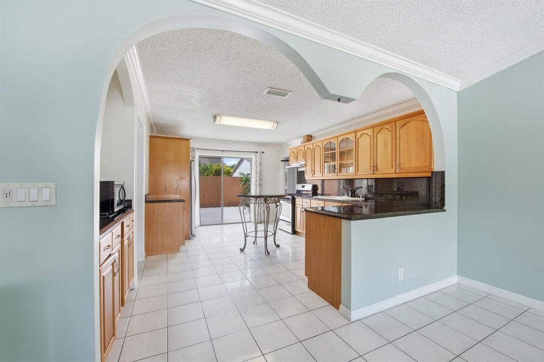 Arched doorways to Kitchen
