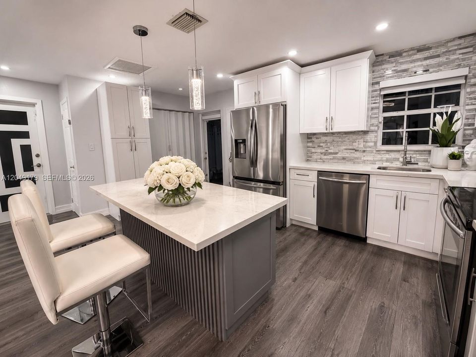 Expansive open-concept living area offering exceptional flexibility for relaxing, entertaining, and everyday living.
