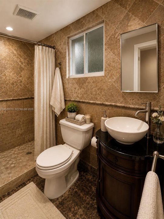 Versatile bedroom currently staged as a home office, offering a spacious closet and endless possibilities to fit your lifestyle.