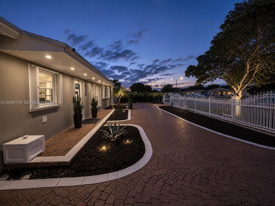Set back from the street with an inviting approach, the home offers a sense of space, privacy, and everyday comfort before you even step inside.