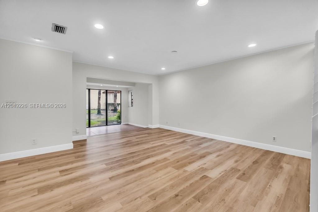 View from dining room overlooking living room and bonus room