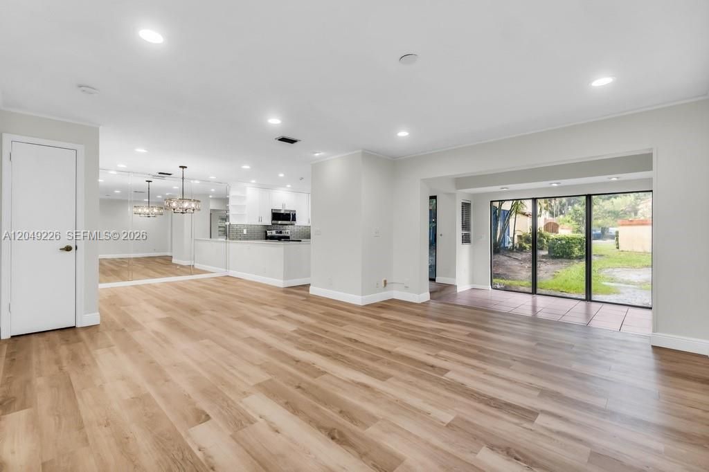 View from the living room towards the dining room and open kitchen