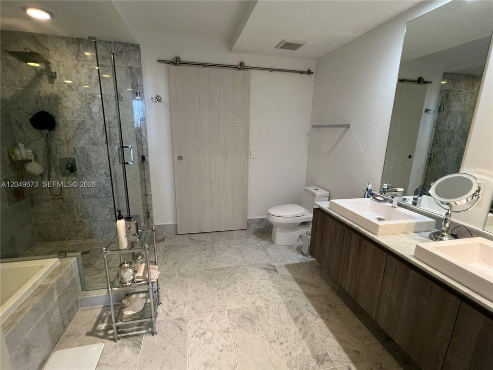 Master Bathroom with Double Sinks, Shower and Bathtub