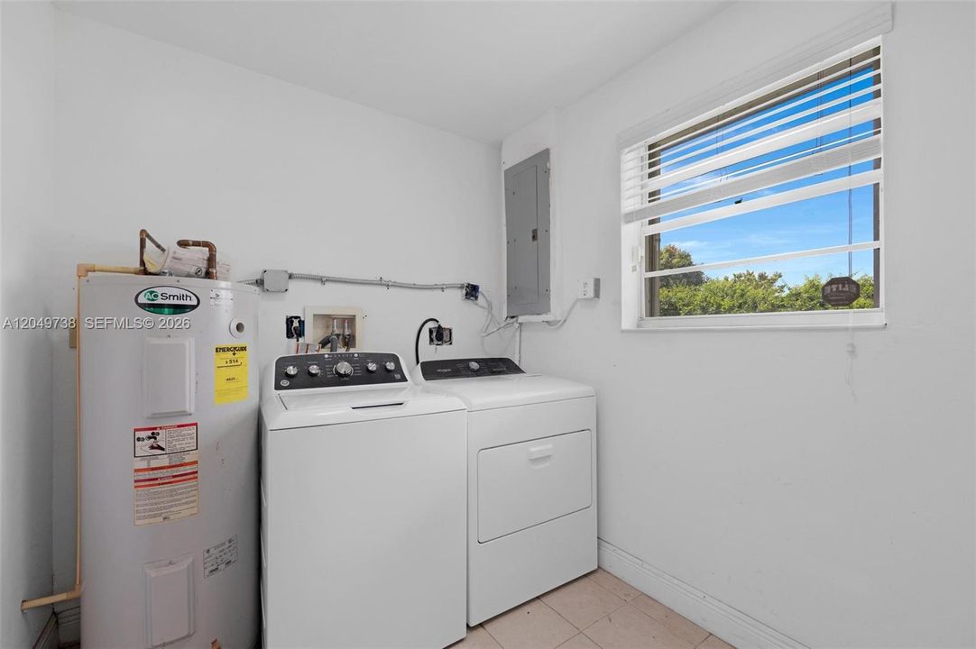 Washer and Dryer in the utility room in garage