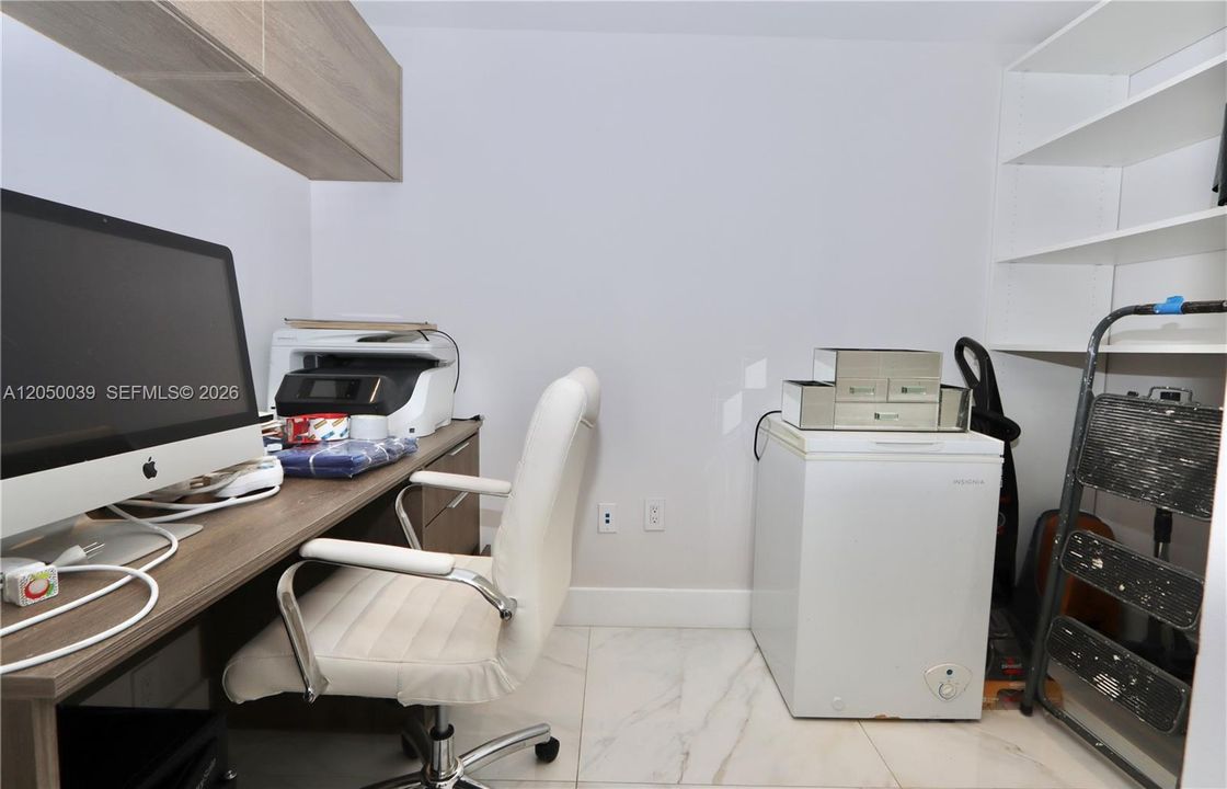 Walk in closet used as office