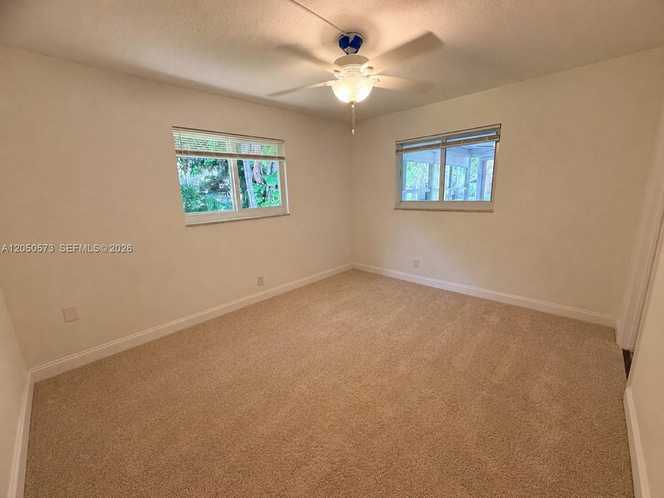 Lots of natural light in primary bedroom.