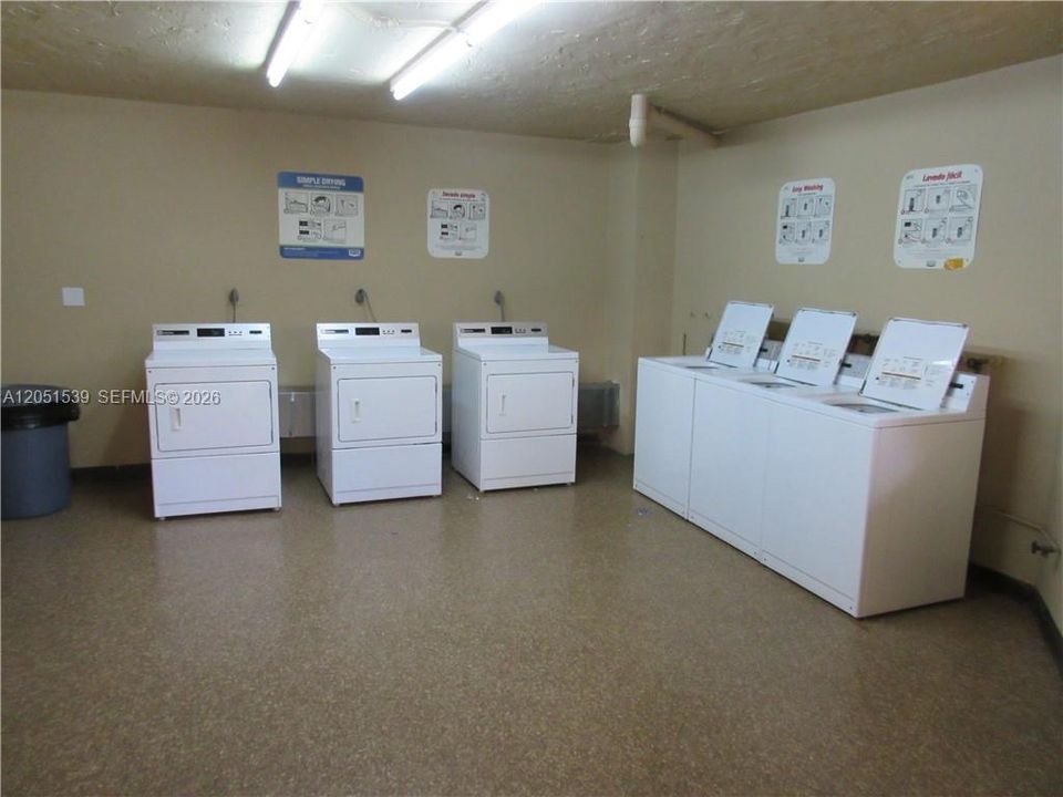 3 WASHING MACHINES & 3 DRYERS ON EACH FLOOR= 9 TOTAL IN BLDG