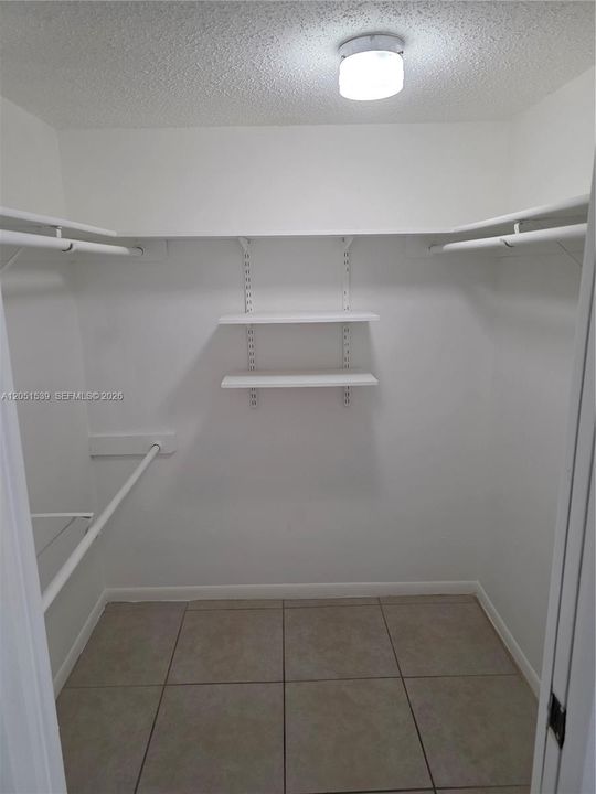 WALK IN CLOSET IN MASTER BEDROOM