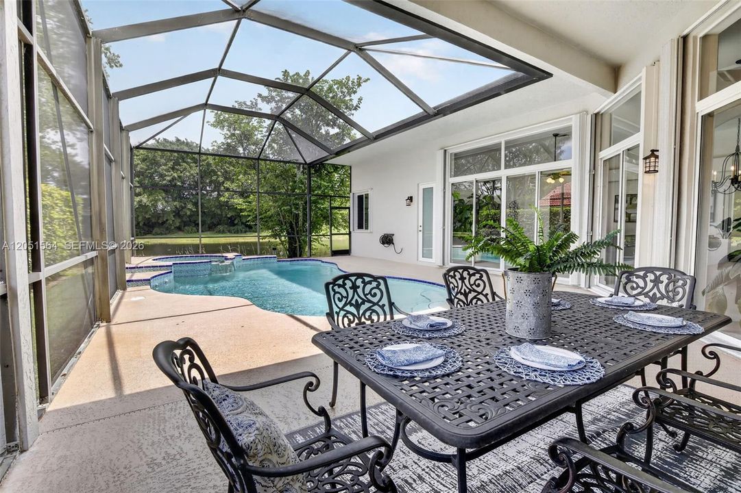 Covered patio, lots of space for entertaining overlooking the lake