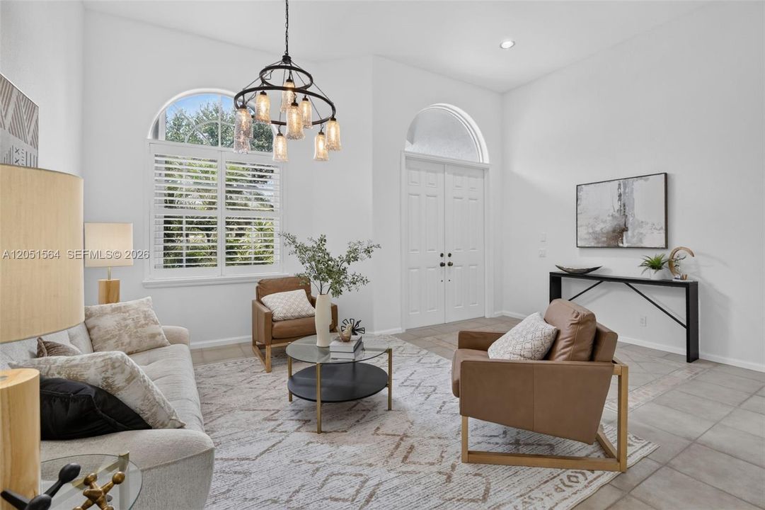 Enter into the home and the views overlooking the pool and lake are so peaceful