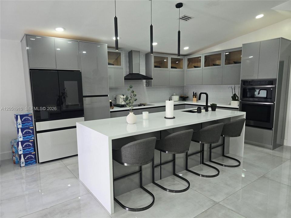 Wall ovens are not included. They will be replaced by a built-in microwave and a cabinet.