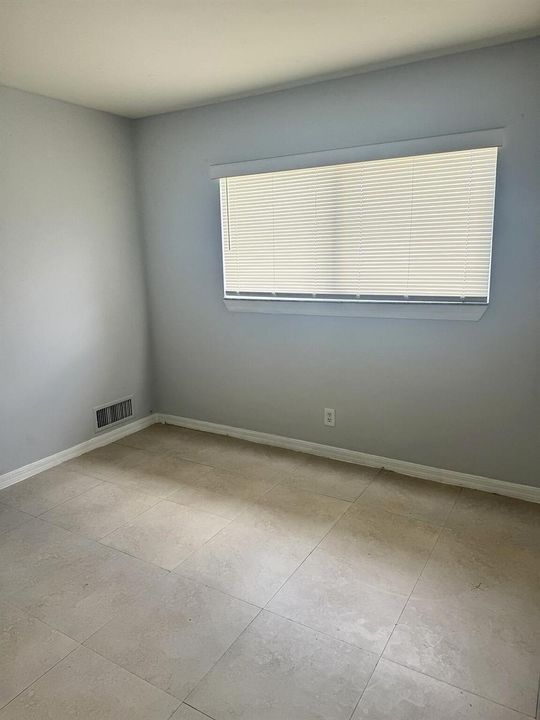 south-florida-home-tiled-bedroom