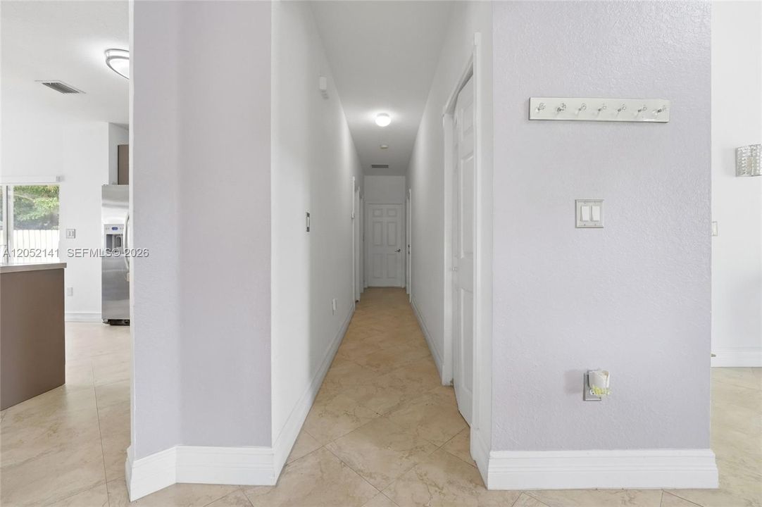 Downstairs hallway leading to bedroom and full bath downstairs