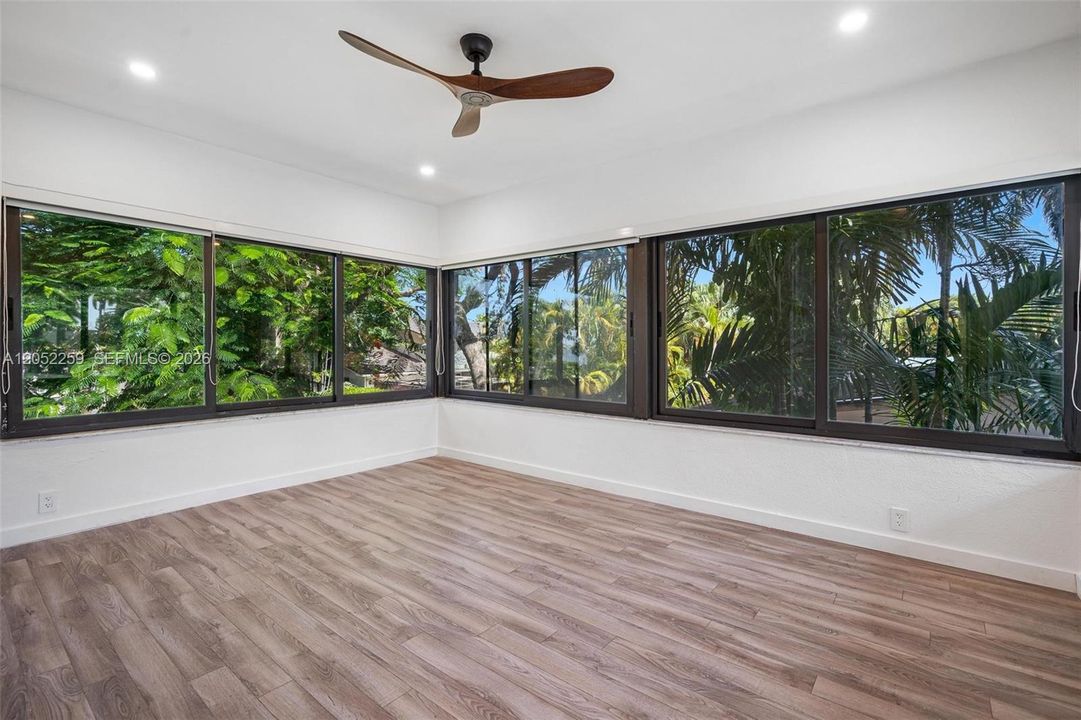 Private second-floor primary suite with dedicated sitting room or office