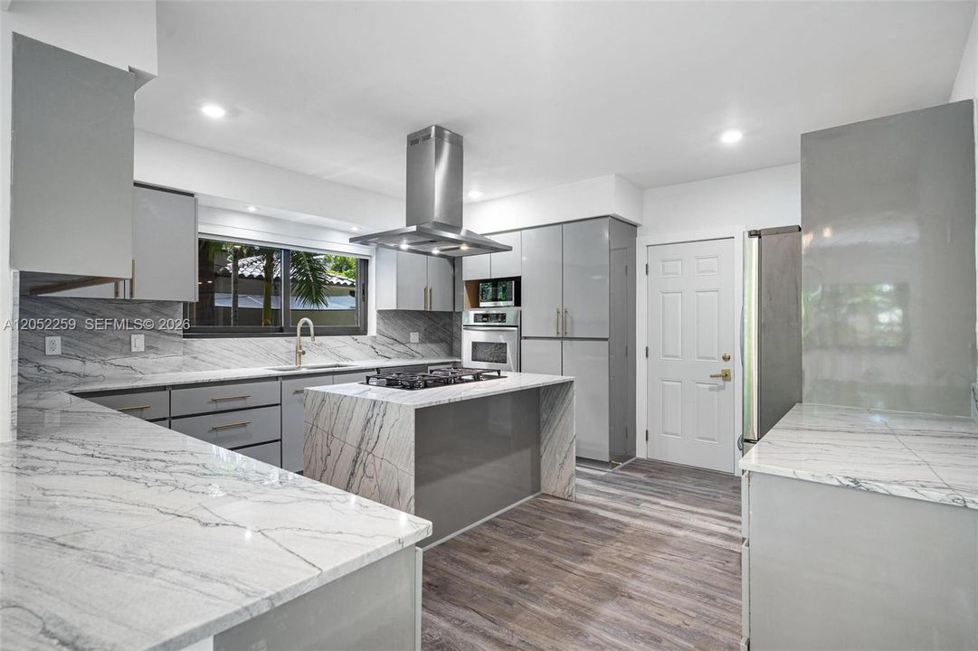 Spacious kitchen with center island, open to the dining area
