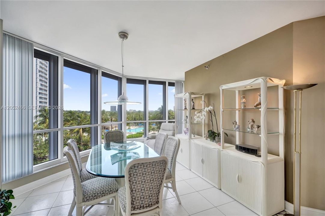 Dining room with garden and pool views.