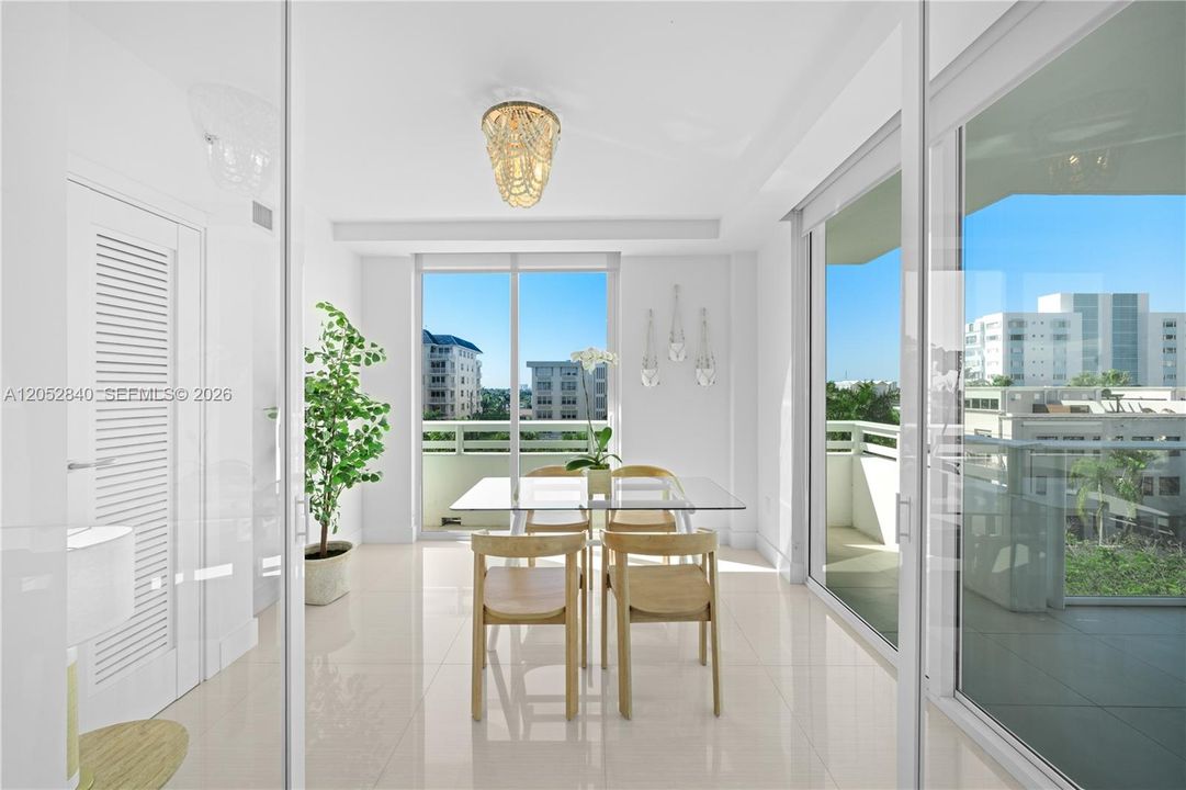 Dining room with glass doors, can be used as a home office as well.