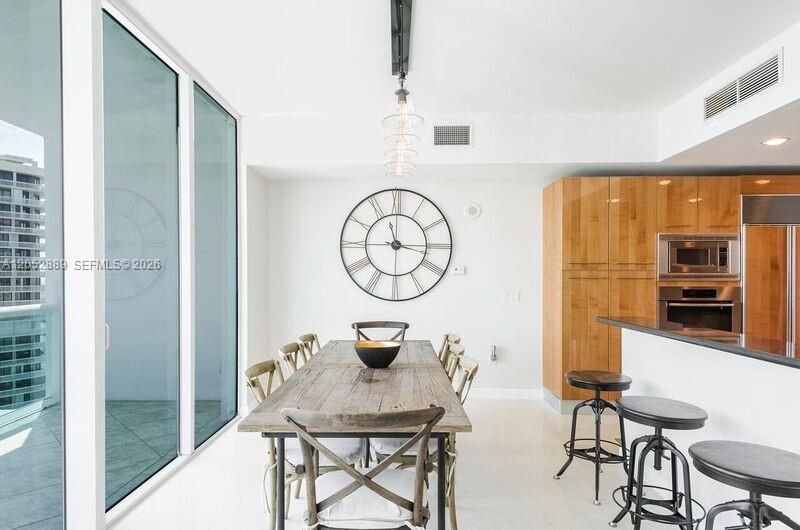 DINING ROOM LOCATED RIGHT NEAR THE KITCHEN.