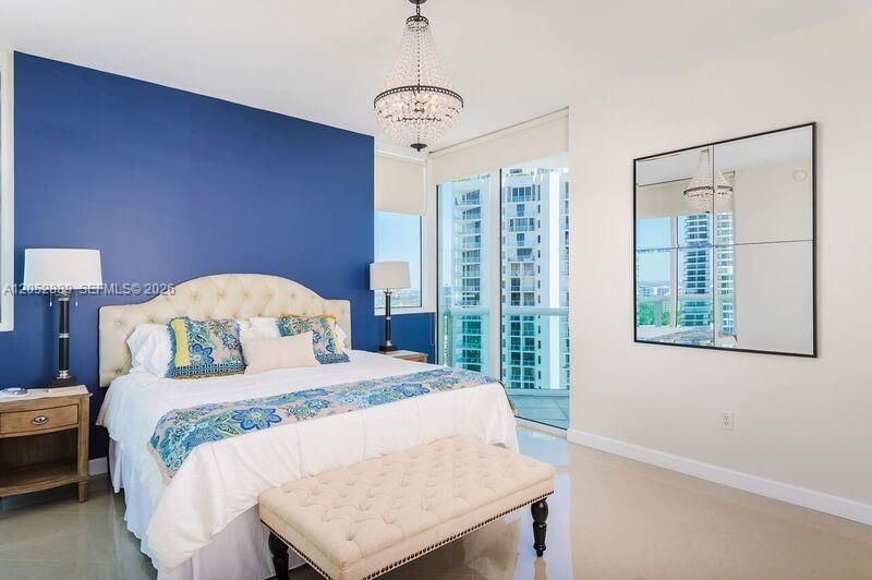 LARGE PRIMARY BEDROOM FEATURES VIEWS, 2 WALK IN CLOSETS, AND A SPA LIKE MARBLE BATHROOM