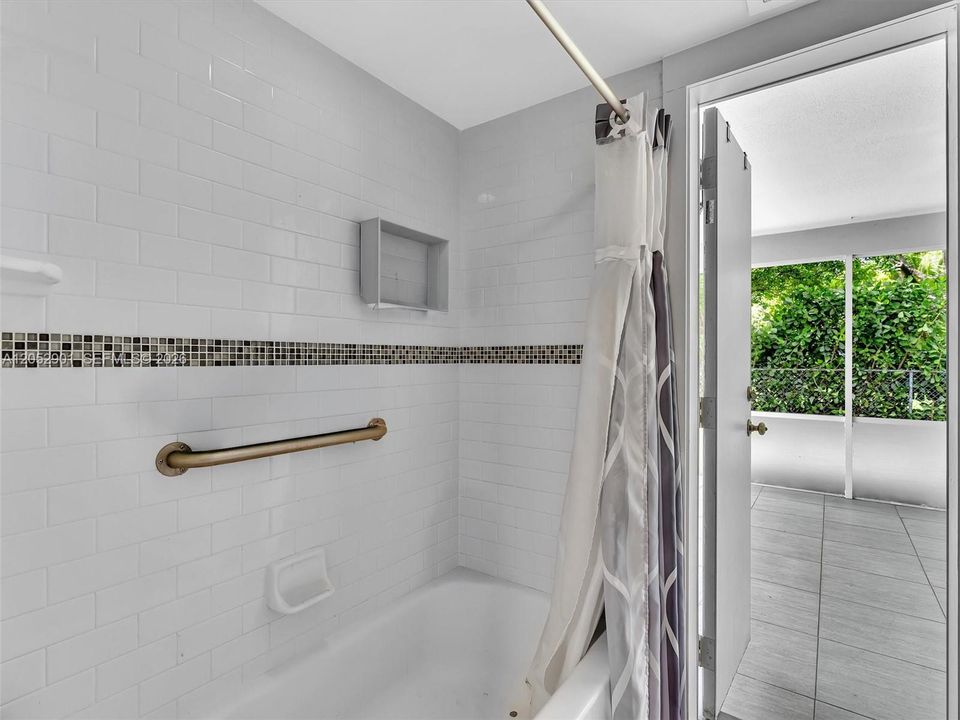 Guest bathroom with cabana door out to back patio