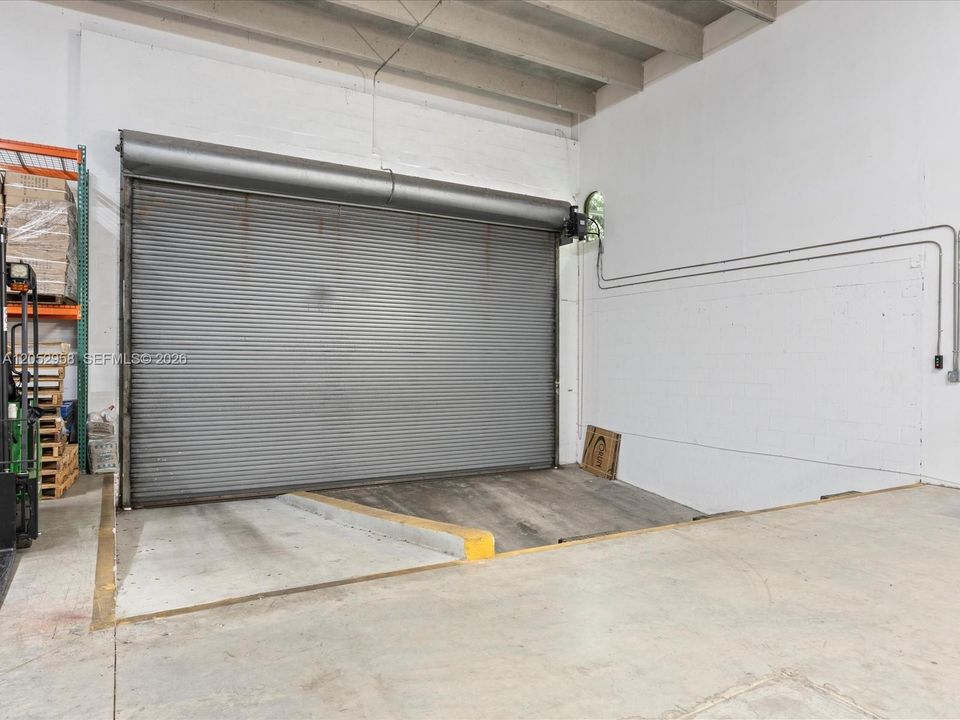 Motorized Door w/built in concrete ramp & recessed dock height loading