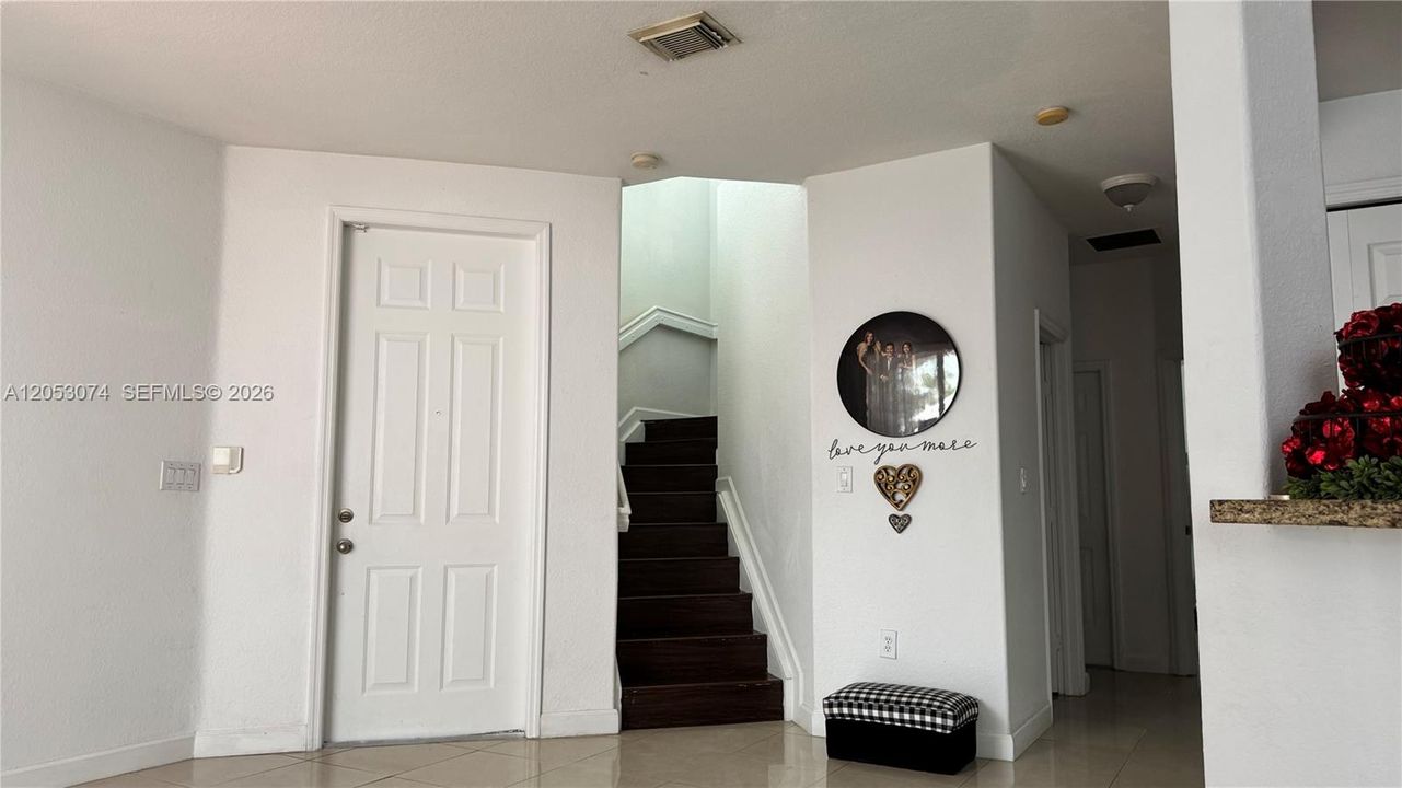 Stairs to Second Floor and main entrance