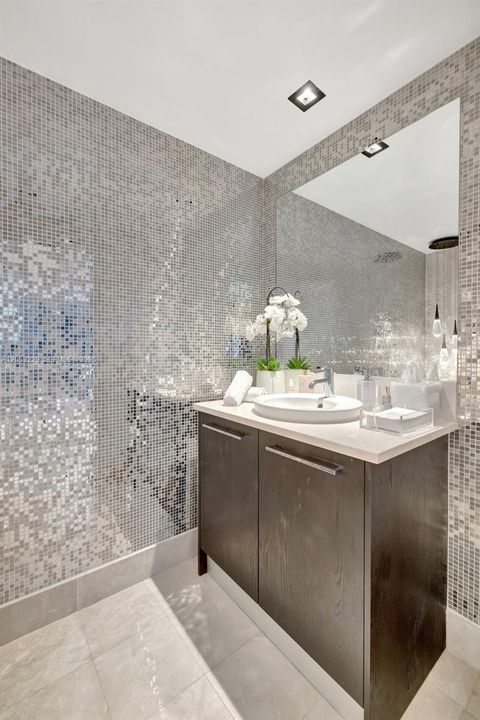 Half Bathroom Near the Entrance and Kitchen
