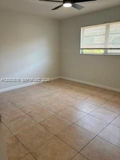 2nd guest bedroom with tile flooring