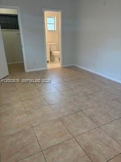Primary Bedroom with en-suite bath, tile flooring
