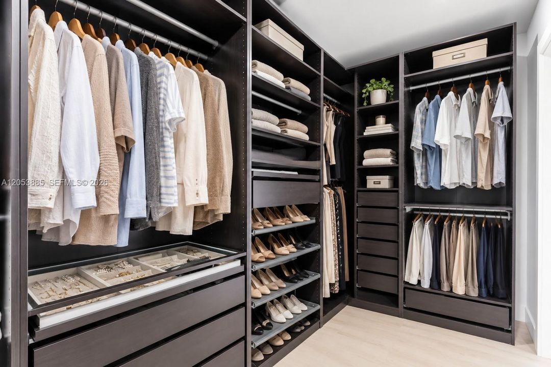 primary bedroom walk-in built in closet