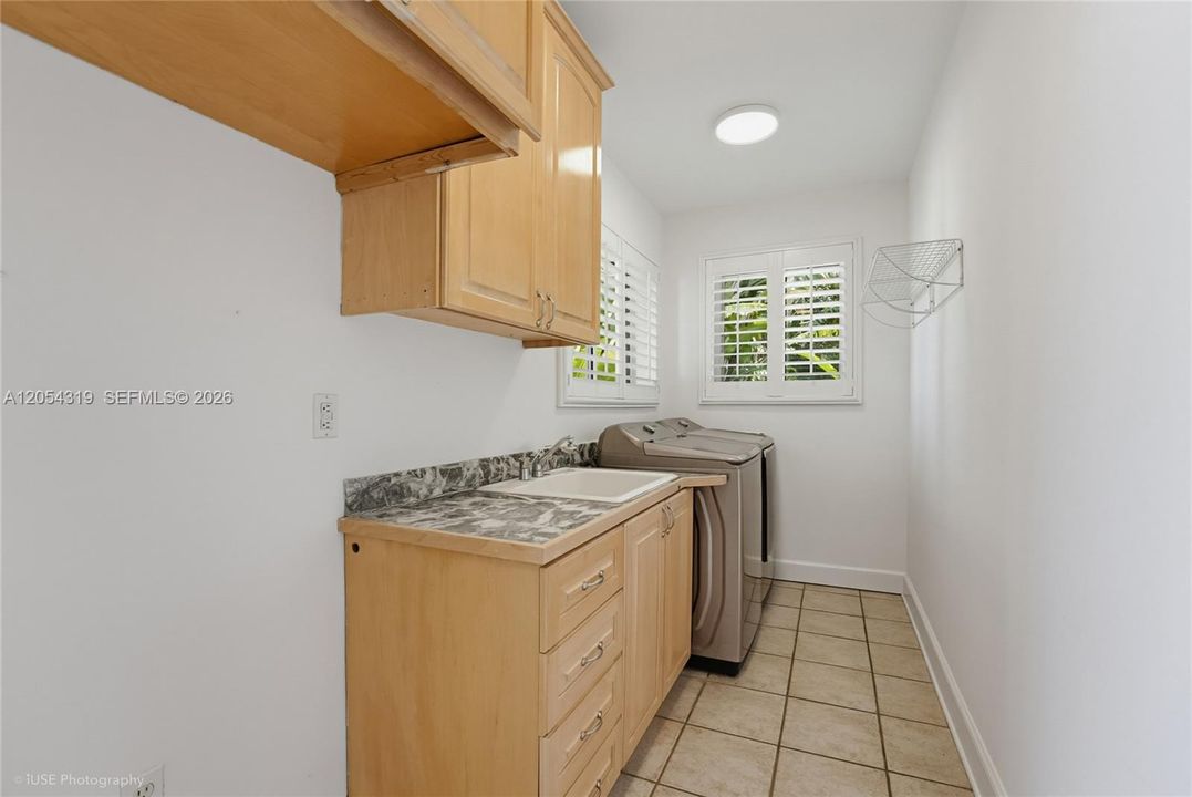 Indoor Laundry with Sink (and room for a second fridge)