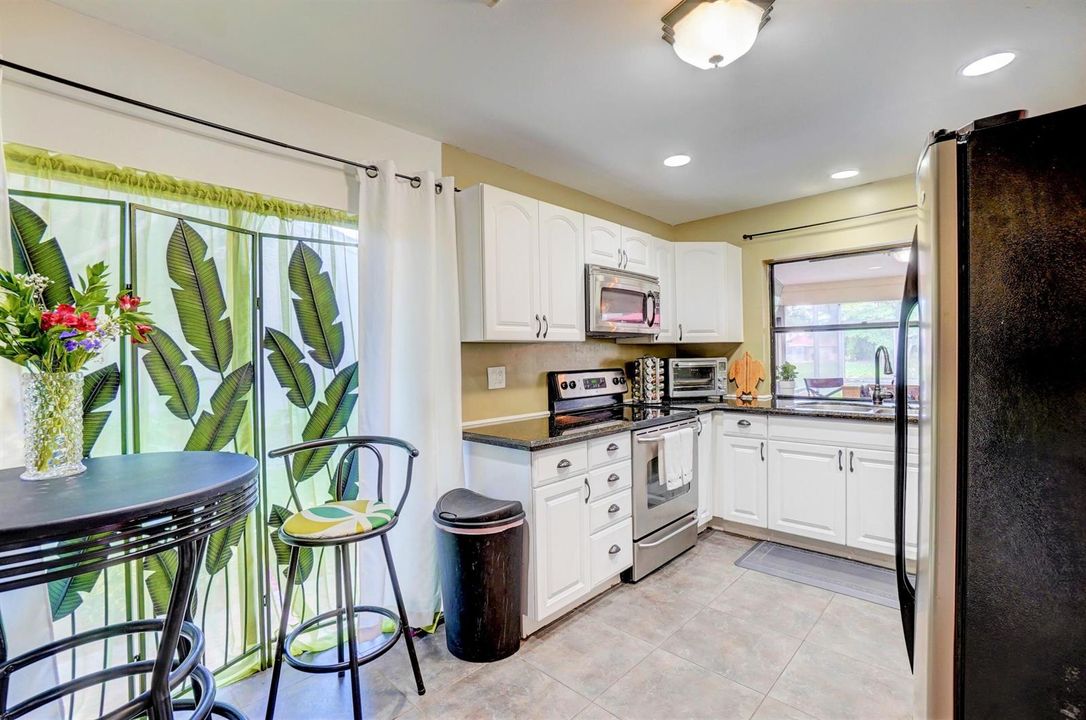 Enter the kitchen beyond dining room..