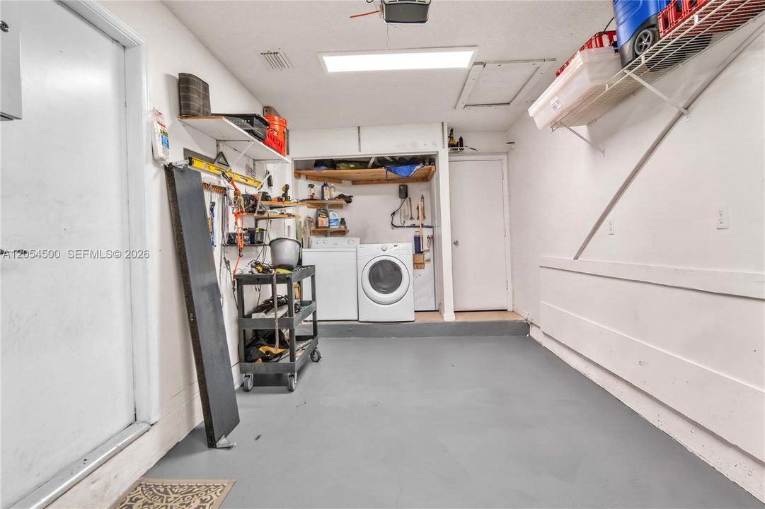 Spacious garage with washer and dryer area