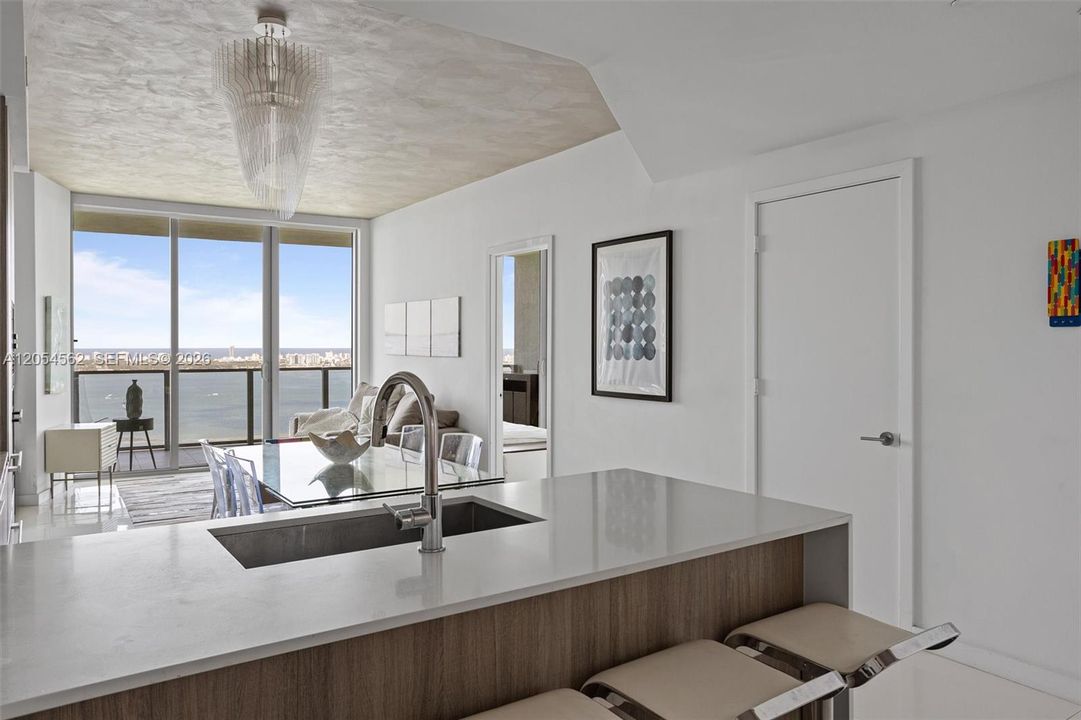 Waterfront kitchen island with integrated sink and premium Miele appliances