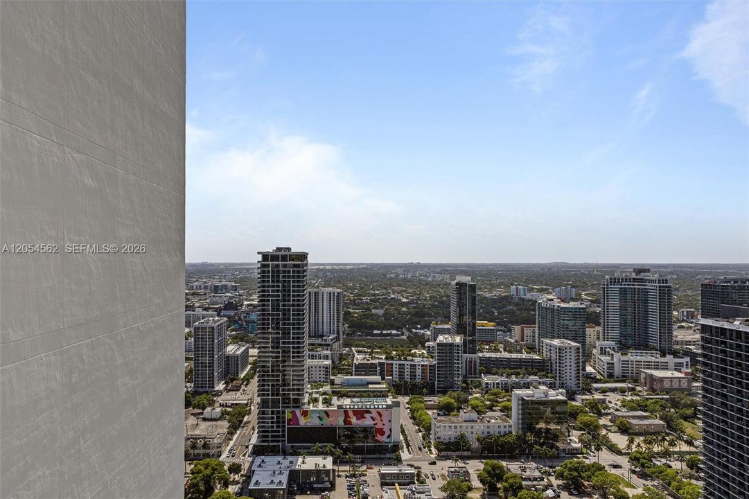 Aerial view over Edgewater and Biscayne Bay toward the Miami skyline