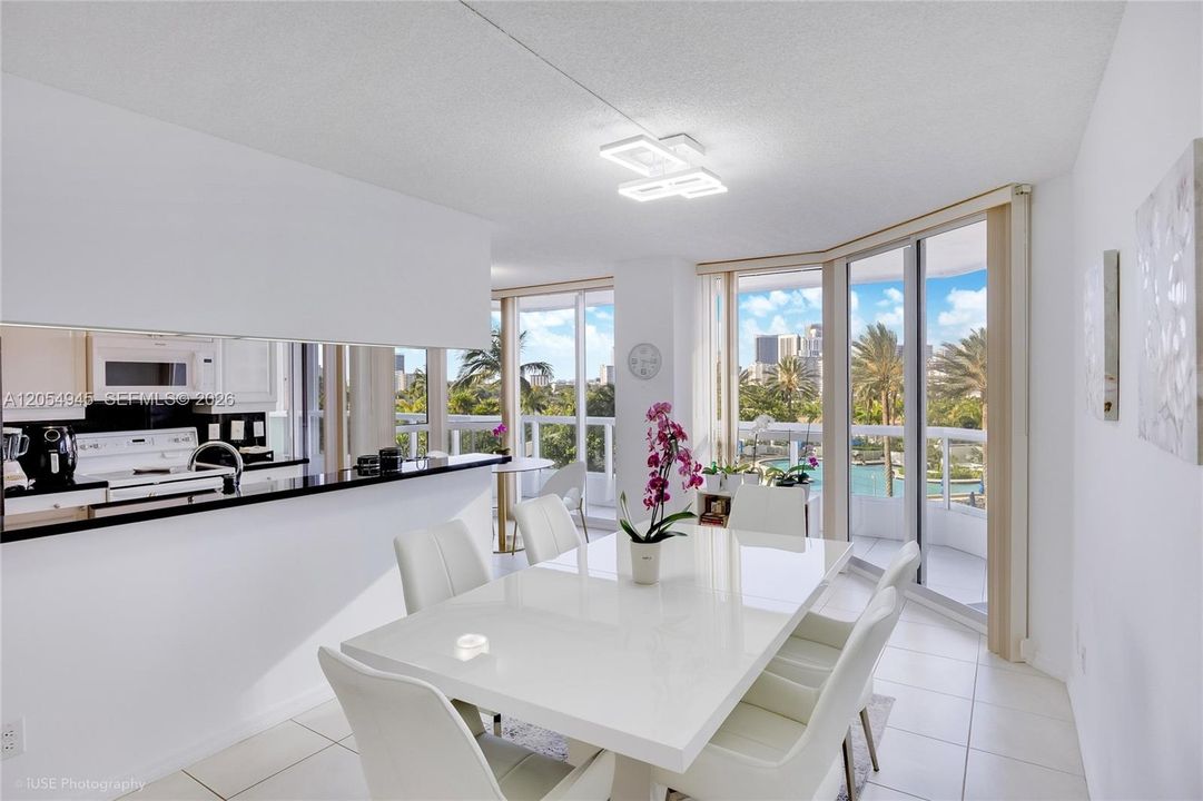 Open floor plan dining area, open kitchen, and breakfast area