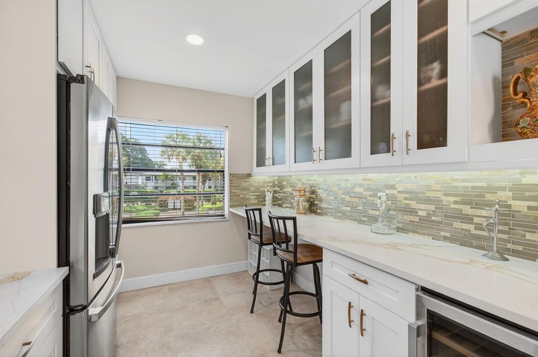 7-Glass Paned Cabinets, Wine Frig
