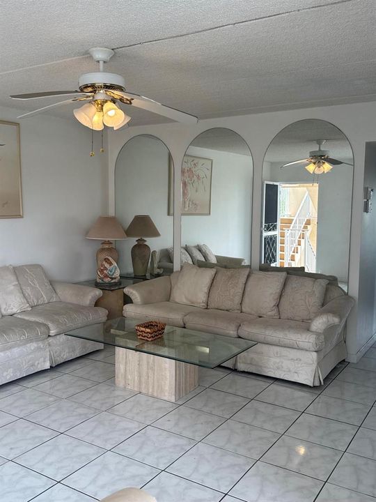 Large living room with accents mirrors
