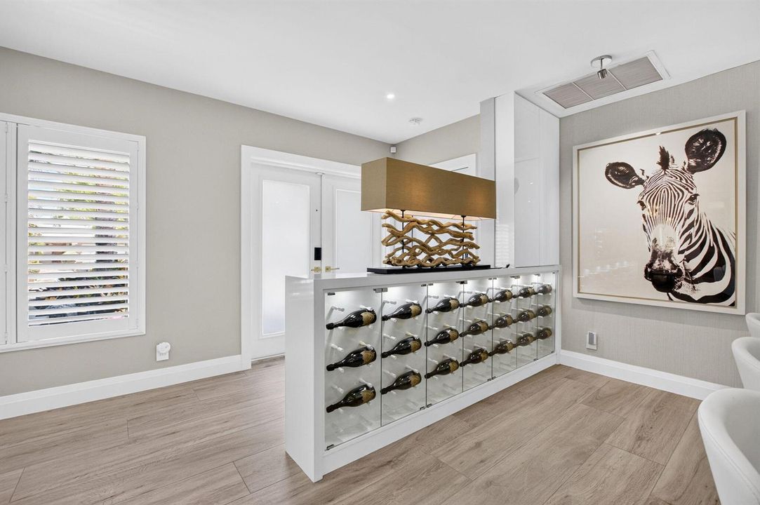 FOYER VIEW WITH WINE WALL