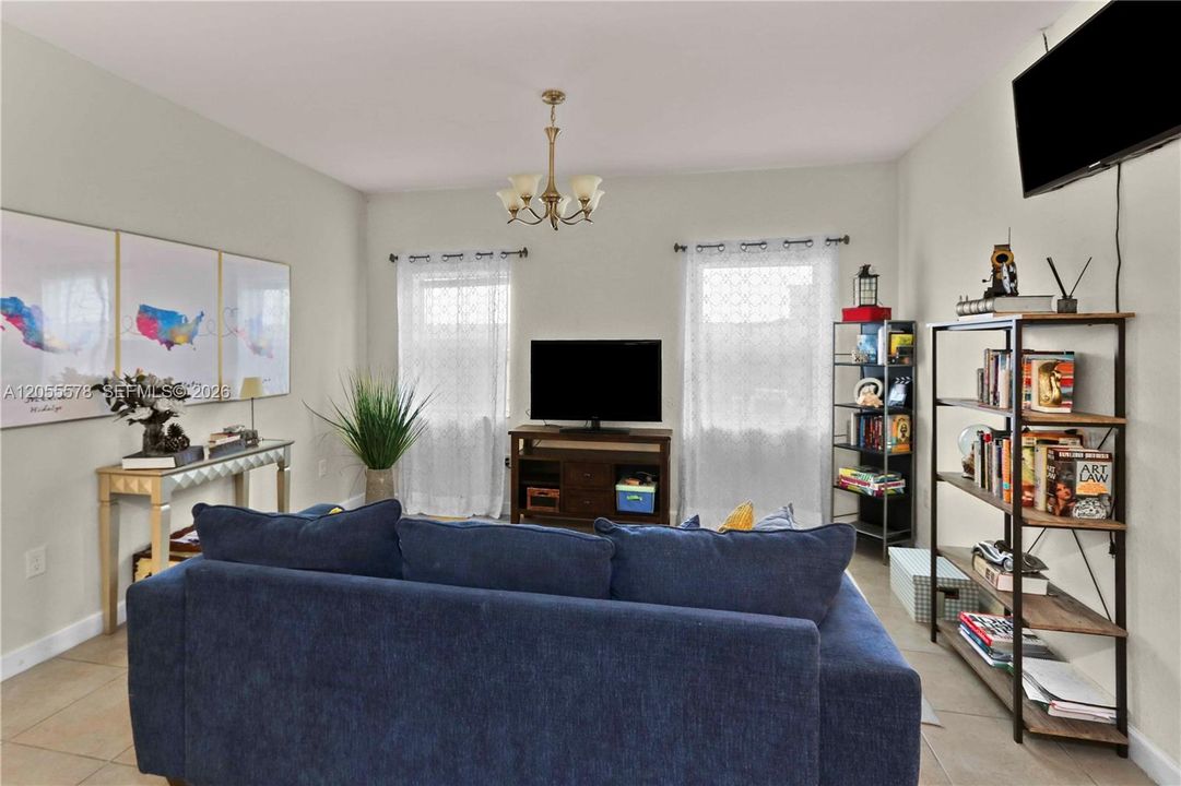 Bright and inviting, this additional living space offers a cozy retreat with plenty of natural light—the perfect spot to relax or entertain friends and family