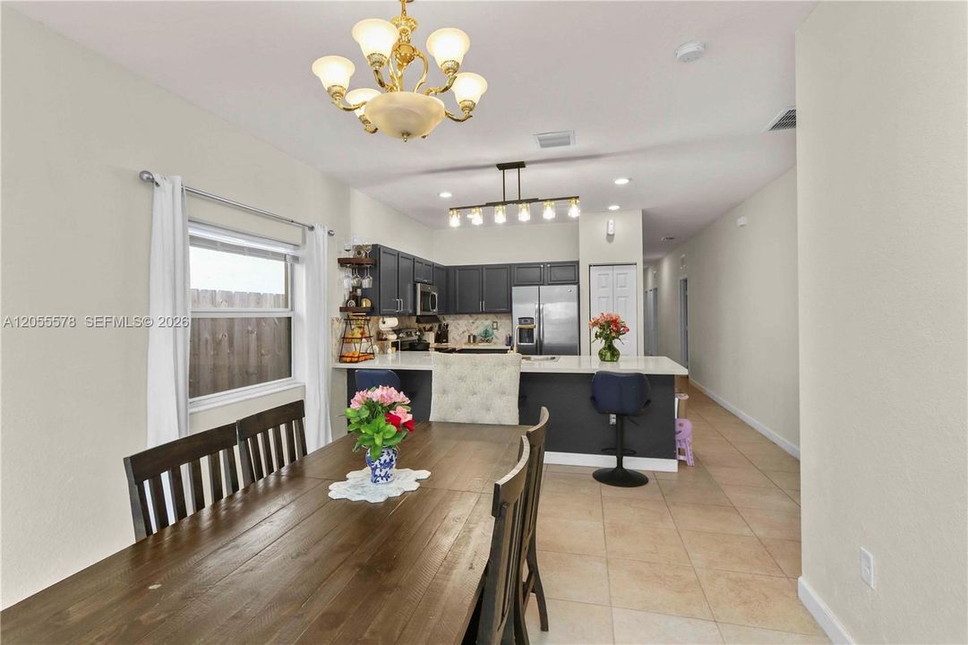 Step into comfort! This inviting living area flows seamlessly from the entryway, creating an open and airy atmosphere that’s perfect for relaxation and welcoming guests.
