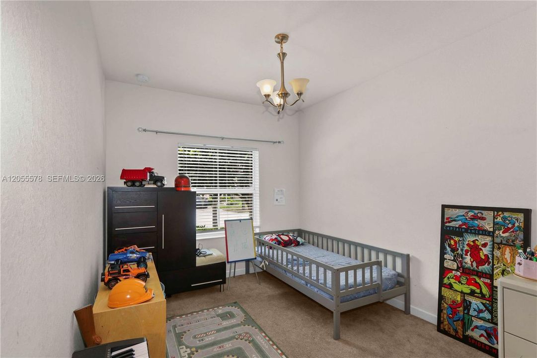 Cheerful and bright, this inviting bedroom is perfect for rest or play. With a comfortable layout and plenty of natural light, it offers a wonderful space that easily adapts to your family's needs