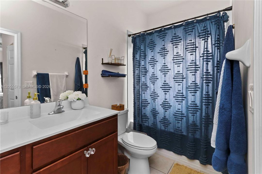 Clean and bright! This well-maintained bathroom offers a crisp, refreshing aesthetic with a clean vanity and tasteful finishes, making it a comfortable space for everyday use