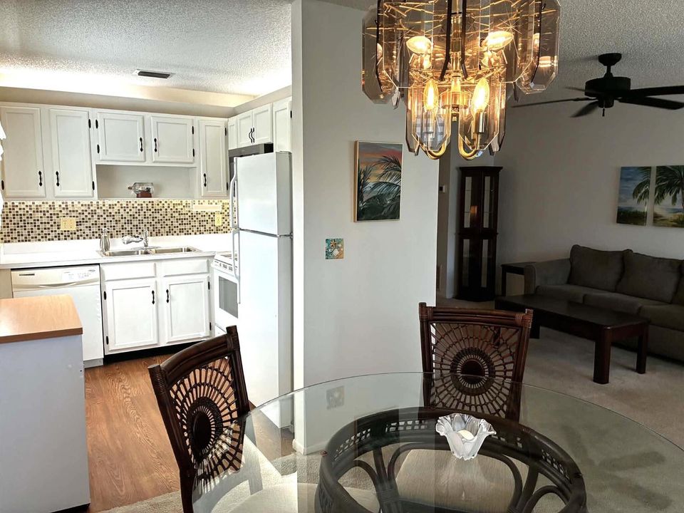 Dining to Kitchen to Living Room