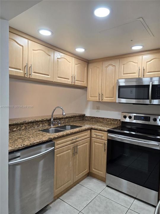 Kitchen features recessed lighting.