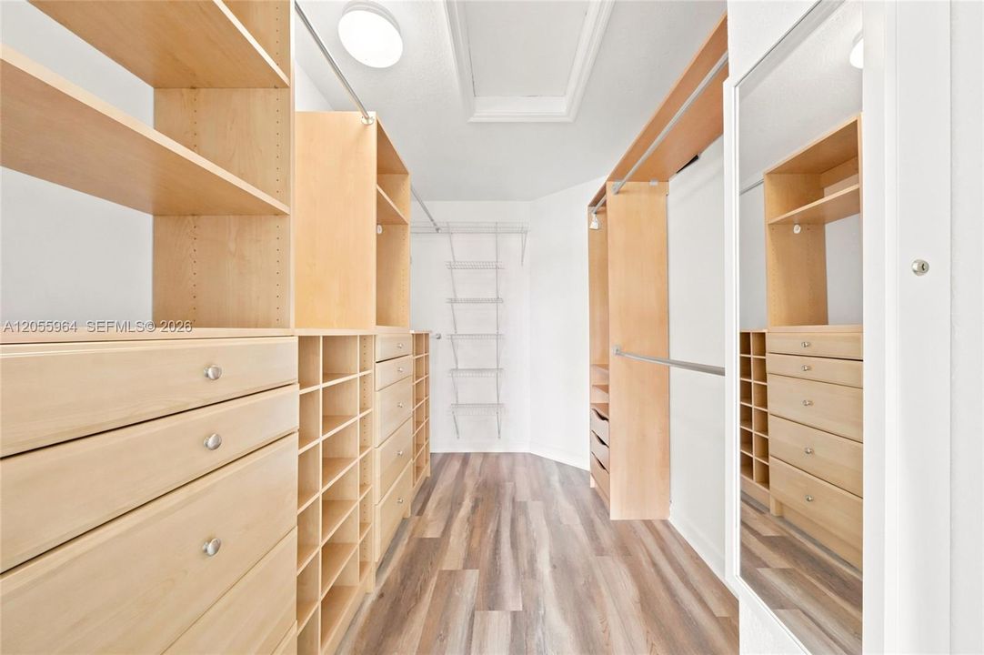 Primary bedroom walk-in closet