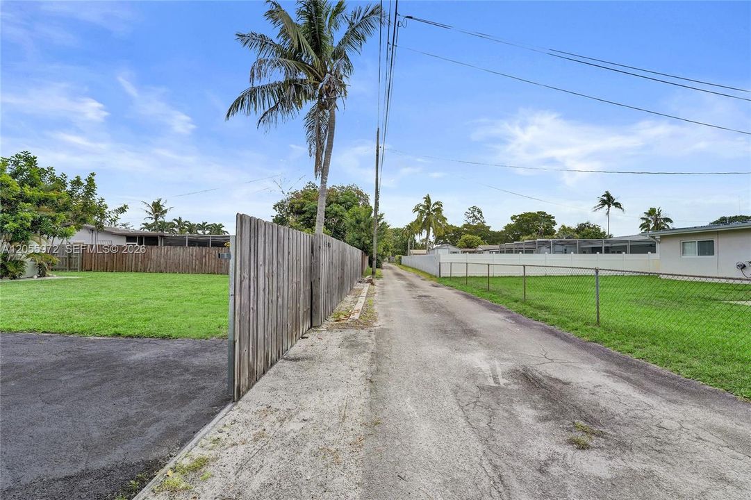 Alley located in rear of home with entrance to driveway and garage.
